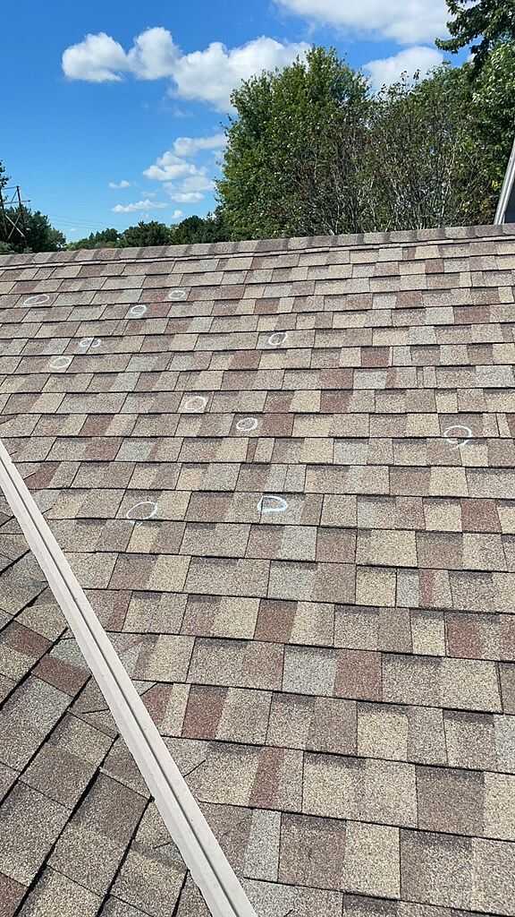 Before Hail damaged roof repair in Oconomowoc